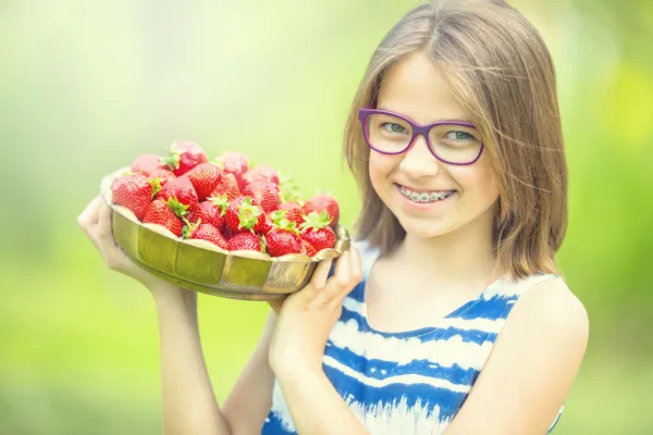 Girl Braces Strawberries